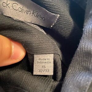 Black Calvin Klein dress shirt.